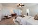 A bright main bedroom with a ceiling fan, neutral walls and carpet at 42367 Glen Abbey Dr, Elizabeth, CO 80107