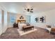 A bright main bedroom with a ceiling fan, neutral walls and carpet at 42367 Glen Abbey Dr, Elizabeth, CO 80107