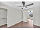 This bedroom features a ceiling fan, carpet in the closet, and light gray walls at 6631 E 77Th Pl, Commerce City, CO 80022