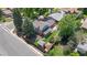 Aerial view of home featuring a fenced backyard, covered patio, landscaped yard, and mature trees at 2117 S Balsam Ct, Lakewood, CO 80227