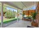 Back patio featuring outdoor seating, a privacy fence, manicured landscaping, and a charming backyard view at 2117 S Balsam Ct, Lakewood, CO 80227
