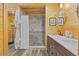 Bathroom featuring a tiled shower and natural wood plank walls and ceiling at 2117 S Balsam Ct, Lakewood, CO 80227
