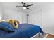 Bedroom featuring a ceiling fan, and large double-door closet at 2117 S Balsam Ct, Lakewood, CO 80227
