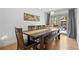 Inviting dining area with a wooden table and bench seating next to the patio doors at 2117 S Balsam Ct, Lakewood, CO 80227