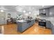 Modern kitchen featuring a large island, stainless steel appliances, and plenty of counter space at 2117 S Balsam Ct, Lakewood, CO 80227