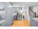 Bright kitchen boasting modern cabinetry, stainless steel appliances, granite countertops, and hardwood floors at 2117 S Balsam Ct, Lakewood, CO 80227