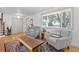 Inviting space with hardwood floors, comfortable armchairs, and a bright window with backyard views at 2117 S Balsam Ct, Lakewood, CO 80227