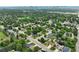 An aerial view of a neighborhood featuring tree lined streets and well-kept homes at 3784 Swadley St, Wheat Ridge, CO 80033