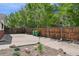 Large, fenced backyard with concrete patio and space for outdoor activities at 3784 Swadley St, Wheat Ridge, CO 80033