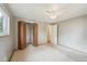 Bedroom featuring carpet, a window, and a closet with doors at 3784 Swadley St, Wheat Ridge, CO 80033
