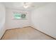 Standard bedroom featuring carpet, a window, and a ceiling fan with light at 3784 Swadley St, Wheat Ridge, CO 80033