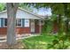 Charming brick home with a well-maintained front yard and mature trees at 3784 Swadley St, Wheat Ridge, CO 80033