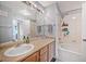 Bright bathroom featuring a vanity, sink, mirror, and a bathtub-shower combination at 12711 Colorado Blvd # 914, Thornton, CO 80241