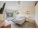 Bright bedroom with a large window, neutral walls, carpet, and a ceiling fan at 12711 Colorado Blvd # 914, Thornton, CO 80241