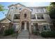 Beautiful condo building featuring stone accents, covered balconies, and well-maintained landscaping at 12711 Colorado Blvd # 914, Thornton, CO 80241