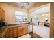 This kitchen offers a stainless steel dishwasher and lots of wooden cabinets at 12711 Colorado Blvd # 914, Thornton, CO 80241