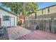 Enclosed backyard space showing a patio and garage, providing an outdoor area for relaxation and entertaining at 1612 N High St, Denver, CO 80218