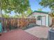 Backyard featuring a brick patio and a wooden deck at 1612 N High St, Denver, CO 80218