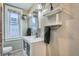 Bathroom featuring a modern vanity, mirror, and natural light at 1612 N High St, Denver, CO 80218