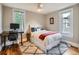 Cozy bedroom with a comfortable bed, desk, and a large area rug for warmth at 1612 N High St, Denver, CO 80218