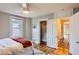 Bedroom featuring a ceiling fan, closet, and natural light at 1612 N High St, Denver, CO 80218
