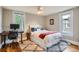 Cozy bedroom with a comfortable bed, desk, and ample natural light at 1612 N High St, Denver, CO 80218