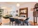 Elegant dining room featuring hardwood floors and a charming fireplace, perfect for gatherings and memorable meals at 1612 N High St, Denver, CO 80218