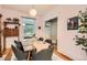 Inviting dining room with hardwood floors, creating a warm and welcoming space for Gathering meals and entertaining guests at 1612 N High St, Denver, CO 80218