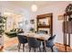 Dining room featuring hardwood floors, decorative fireplace, and view into the living room at 1612 N High St, Denver, CO 80218