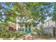 Charming front of home with a welcoming front porch and beautiful landscaping offering an inviting curb appeal at 1612 N High St, Denver, CO 80218