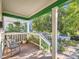 Cozy front porch with seating, plants, and view of the street at 1612 N High St, Denver, CO 80218