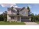 Charming two-story home with stone accents, covered porch, and inviting curb appeal in a well landscaped area at 10816 Snowdon St, Parker, CO 80134