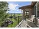 Enjoy mountain views from this outdoor balcony with an outdoor seating area and view into the home at 17490 W 67Th Ave, Arvada, CO 80007