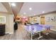 Finished basement including a ping pong table, entertainment area, and wet bar at 17490 W 67Th Ave, Arvada, CO 80007