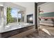Relaxing bath with a fireplace and views at 17490 W 67Th Ave, Arvada, CO 80007