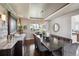Elegant dining room with stylish decor, wood accents, and ample seating at 17490 W 67Th Ave, Arvada, CO 80007