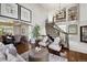 Elegant foyer with grand staircase, hardwood floors, and sophisticated decor at 17490 W 67Th Ave, Arvada, CO 80007