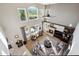 Bright living room with vaulted ceilings, fireplace, and large windows with scenic views at 17490 W 67Th Ave, Arvada, CO 80007