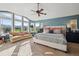 Large main bedroom features vaulted ceilings, scenic views, and comfortable sitting area at 17490 W 67Th Ave, Arvada, CO 80007
