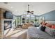 Spacious main bedroom boasts a fireplace, sitting area, and scenic outdoor views at 17490 W 67Th Ave, Arvada, CO 80007