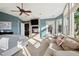 Bedroom featuring a fireplace, ensuite access, and a comfortable sitting area at 17490 W 67Th Ave, Arvada, CO 80007
