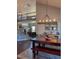 Open concept dining room featuring wood floors, modern lighting and an open staircase to the second floor at 5893 Lasso Pl, Parker, CO 80134