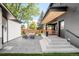 A lovely, modern patio features an outdoor dining area and comfortable lounge seating, perfect for relaxing or entertaining at 1462 S Vine St, Denver, CO 80210