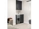 Contemporary bar area with sleek cabinetry, beverage fridge and modern sink at 1462 S Vine St, Denver, CO 80210