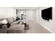 Finished basement with plush carpeting, comfortable seating, and a media center at 1462 S Vine St, Denver, CO 80210