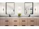 Bathroom with double sink vanity, modern lighting, and framed mirrors at 1462 S Vine St, Denver, CO 80210