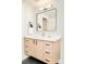 Bathroom featuring modern vanity with light wood finish, a square mirror, and stylish black hardware at 1462 S Vine St, Denver, CO 80210