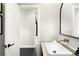 Bright bathroom featuring a modern sink, large mirror, and sleek fixtures at 1462 S Vine St, Denver, CO 80210