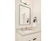 Clean and stylish bathroom vanity with a neutral color palette and modern mirror at 1462 S Vine St, Denver, CO 80210