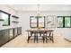 Bright dining room with a modern chandelier, black accents, and dining table with seating for six at 1462 S Vine St, Denver, CO 80210